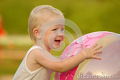 Happy child holds ball Stock Photo