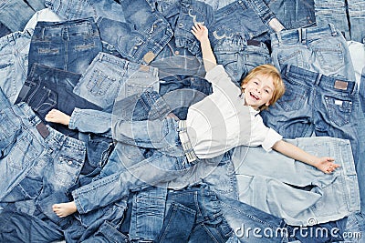 Happy child on jeans background. Denim fashion Stock Photo