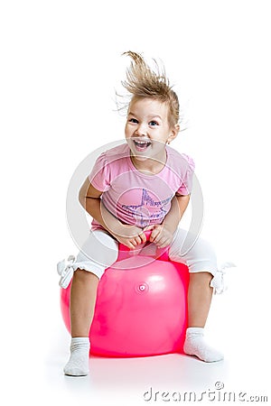 Happy child jumping on bouncing ball isolated Stock Photo
