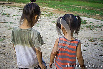 Happy child playing with sand, Funny Asian family in a park Stock Photo