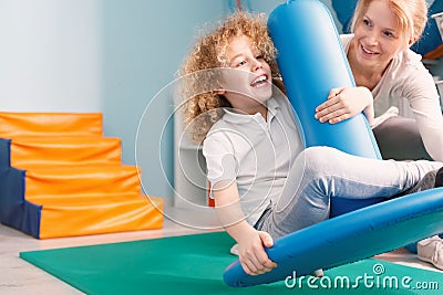 Happy child and professional therapist Stock Photo