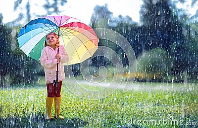Happy Child With Rainbow Umbrella Stock Photo