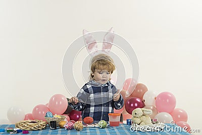 Happy child showing thumbs up. Happy easter. Children painting Easter eggs. Happy family preparing for Easter. Stock Photo