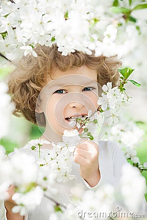 Happy child with spring flower Stock Photo
