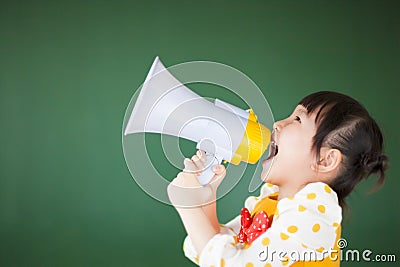 Happy child using a megaphone Stock Photo