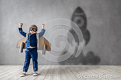 Happy child wants to fly. Imagination, freedom and motivation concept Stock Photo