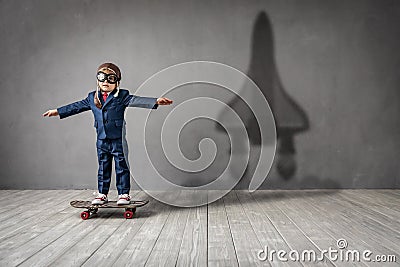 Happy child wants to fly. Imagination, freedom and motivation concept Stock Photo