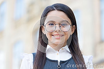 Happy child wear round-framed eye glasses and formal fashion uniform knowledge day, look. school education Stock Photo