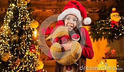 Happy childhood concept. Kid santa hat. Santa brought gifts. Time for miracles. All I want for christmas. Happiness and Stock Photo