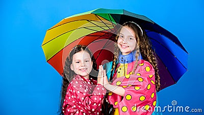 Happy childhood. It is easier to be happy together. Be rainbow in someones cloud. Walk under umbrella. Kids girls happy Stock Photo