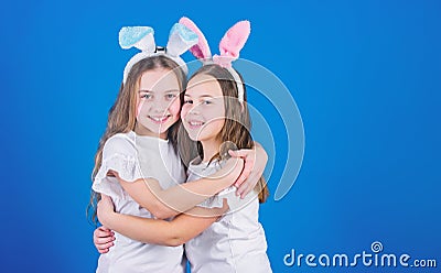 Happy childhood. Friendship concept. Easter vibes. Happy easter. Holiday bunny girls with long bunny ears hug. Children Stock Photo