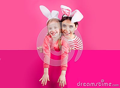 Happy childhood. Girls with bunny ears. Little sister kids celebrate easter. Egg hunt. Spring holiday. Stock Photo