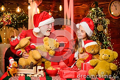 Happy childhood. Lovely present. Child enjoy christmas with grandfather Santa claus. Happiness and joy. Present surprise Stock Photo