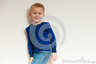 Happy childhood. Portrait of smiling blond boy child kid indoor Stock Photo