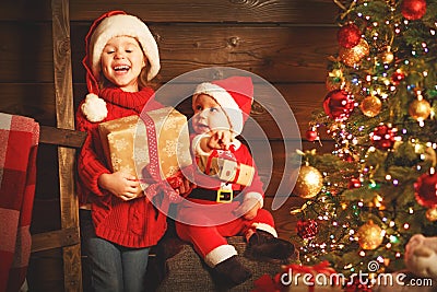 Happy children brother and sister with Christmas present Stock Photo