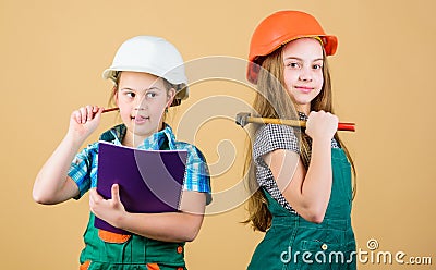 Happy children. Future career. Labor day. 1 may. Little kids in helmet with tablet and hammer. Foreman inspector. Repair Stock Photo