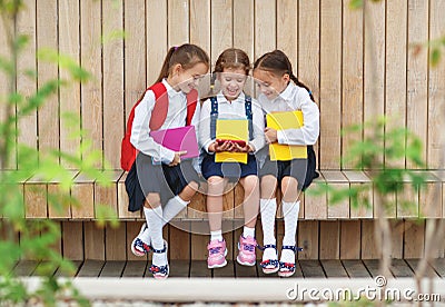 Happy children girlfriends schoolgirls student elementary schoo Stock Photo