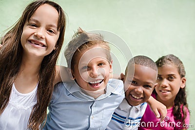 Happy children hugging, smiling and having fun Stock Photo