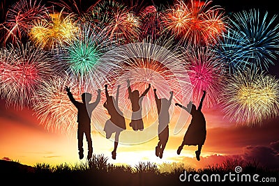 children jumping and watching the fireworks Stock Photo