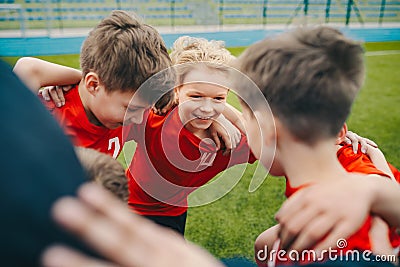 Happy children making sport. Group of happy boys making sports huddle Stock Photo