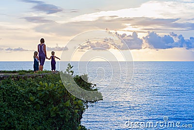 Happy children with mother have fun on summer beach holiday Stock Photo