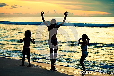 Happy children playing at the beach Stock Photo