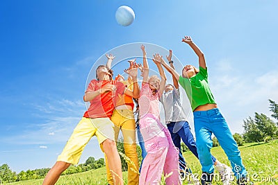 Happy children playing and catching ball Stock Photo