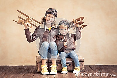 Happy children playing with toy airplane Stock Photo