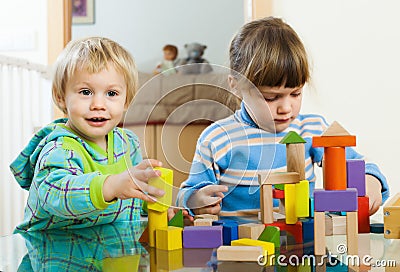 Happy children playing with toys in home Stock Photo