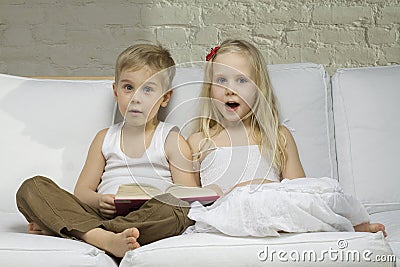 Happy children read a book Stock Photo