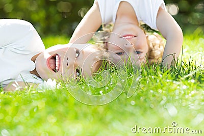 Happy children standing upside down Stock Photo