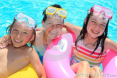 Happy children in swimming pool Stock Photo
