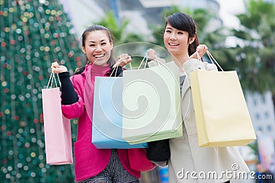 Happy Chinese women go shopping Stock Photo