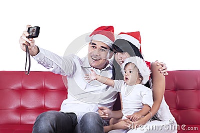 Happy christmas family take a photo Stock Photo