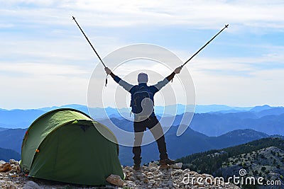 Happy climber setting camp Stock Photo