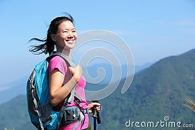 Happy climber woman mountain peak Stock Photo