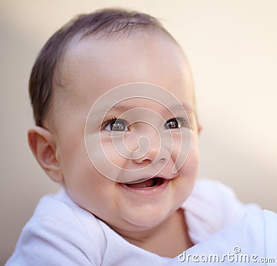 Happy, closeup face of a baby with a smile and health wellness for childhood development. Happiness or excited Stock Photo