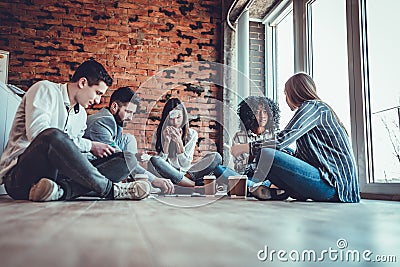 Happy colleagues playing who I am game, having great pastime together Stock Photo