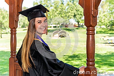 Happy college graduate in tradional attire Stock Photo