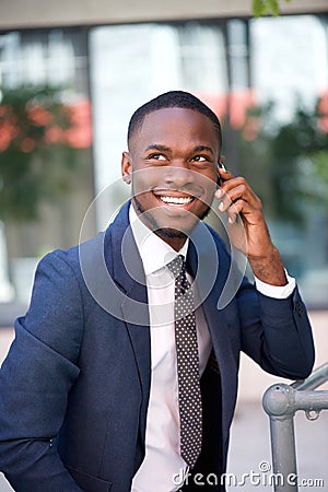 Happy confident businessman calling by cell phone Stock Photo