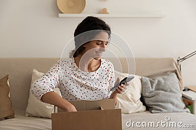 Happy consumer giving feedback to online order delivery Stock Photo