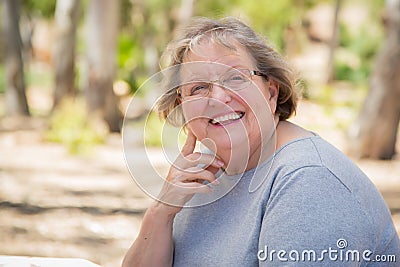 Happy Content Senior Woman Portrait Outdoors Stock Photo