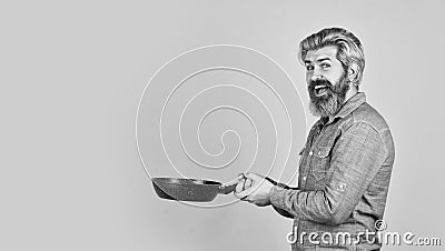 happy cook man hold frying pan. Chef cooking soup. restaurant kitchen. cooking lunch in kitchen. my profession. baker Stock Photo