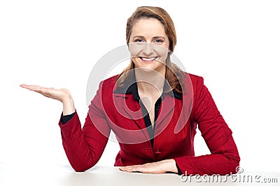 Happy corporate woman presenting copy space Stock Photo