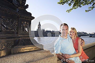 Happy Couple Against Thames River Stock Photo