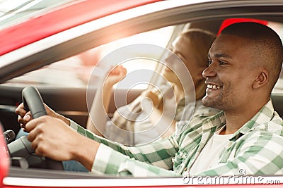 Happy couple buying new car together at the dealership Stock Photo