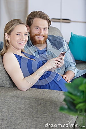 happy couple checking smart phone apps Stock Photo