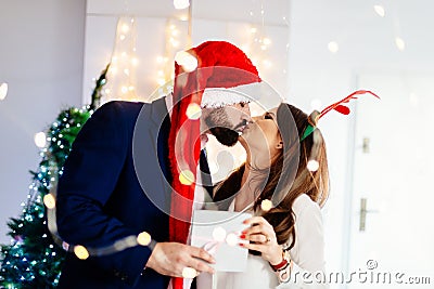 Happy couple at Christmas. Christmas kiss Stock Photo