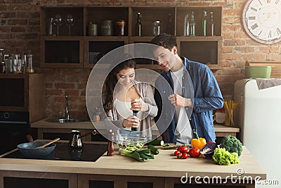 Happy couple cooking healthy food together Stock Photo