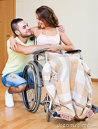 Happy couple with disabled spouse Stock Photo